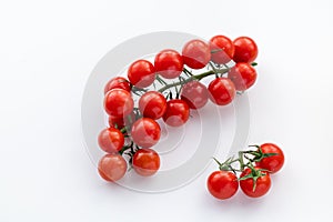 The sprig of red cherry tomatoes