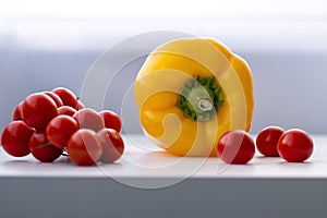 The sprig of red cherry tomatoes on a white background