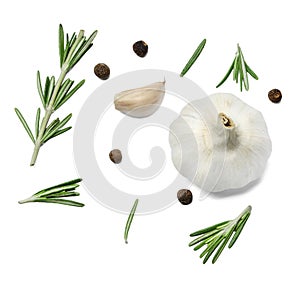 Sprigs and leaves of rosemary, allspice and garlic. White isolated background.