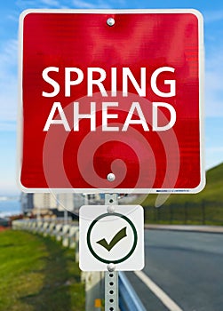 Spring Ahead sign board.