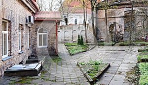 Spring April court yard of the old destroyed European church.