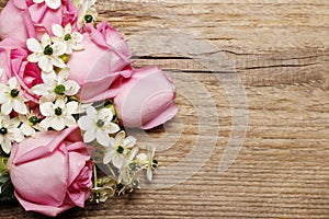 Spring background with pink roses and arabian star flower (ornithogalum arabicum)