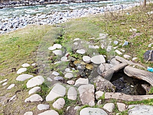 Spring on the bank of a mountain river