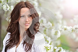 Spring beauty girl. Beautiful young woman in a summer park outdo