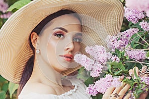 Spring beauty woman with flowers outdoors