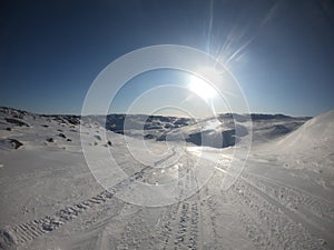 Spring blinding sun on an icy road