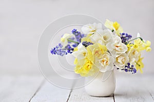 Spring blossoming yellow and white daffodils posy