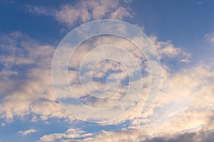 Spring blue sky with a few clouds . On a blue background