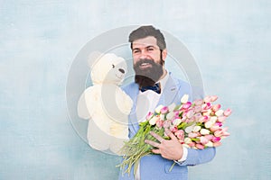 Spring bouquet. 8 of march. bearded man in bow tie with tulip flowers. love date with flowers. Happy Birthday. bride