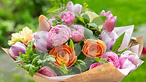 Spring bouquet. Beautiful multi colored fresh flower arrangement. Birthday bouquet made of tulips and ranunculus. photo