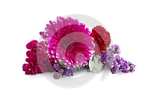 Spring bouquet with gerbera and purple flowers isolated on white