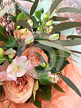 Spring bouquet of mixed colorful flowers. Flowers bouquet including orange rose, white Eustoma. Beautiful bright flowers