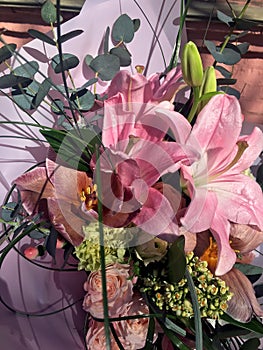 Spring bouquet of mixed colorful flowers. Flowers bouquet including tulips, spray rose, pink lily. Beautiful bright flowers