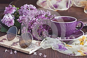 Spring branch lilac flowers on rustic wooden table