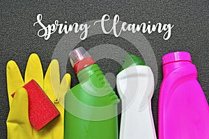 Spring cleaning concept.Colorful set of cleaning supplies with text.