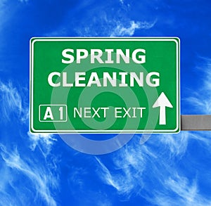 SPRING CLEANING road sign against clear blue sky