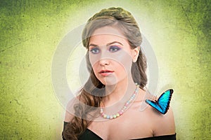 Spring concept of a blonde woman with a blue butterfly