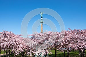 Spring in Copenhagen.Beautiful park and Statue of ancient goddess Victoria.