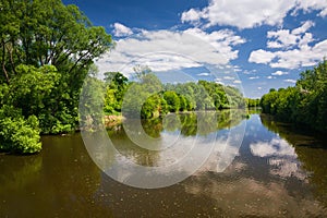 Spring countryside - river and blue sky with clouds