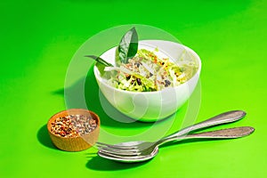Spring diet salad. Fresh vegan vitamin food. Sliced cabbage, spices, olive oil, dry berries