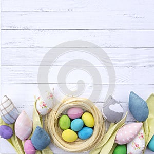 Spring easter background for sale banner or Instagram post. Patchwork handmade tulips and a nest with Easter eggs on a background