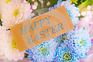 Spring Easter card. Happy Easter text on greeting card, Bouquet of chrysanthemums background