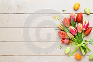 Spring easter tulips in bucket on white vintage background.