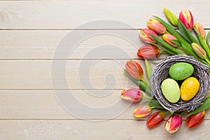 Spring easter tulips in bucket on white vintage background.