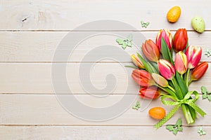 Spring easter tulips in bucket on white vintage background.