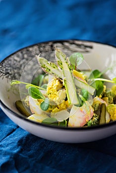 Spring egg salad with asparagus and microgreens