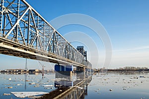 Spring evening in Arkhangelsk. Ice drift on the Severnaya Dvina river. The world`s northernmost drawbridge