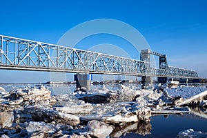 Spring evening in Arkhangelsk. Ice drift on the Severnaya Dvina river. The world`s northernmost drawbridge