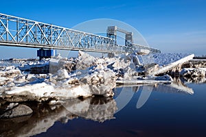 Spring evening in Arkhangelsk. Ice drift on the Severnaya Dvina river. The world`s northernmost drawbridge