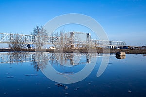 Spring evening in Arkhangelsk. Ice drift on the Severnaya Dvina river. The world`s northernmost drawbridge