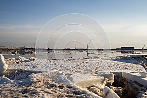 Spring evening in Arkhangelsk. Ice drift on the Severnaya Dvina river. The world`s northernmost drawbridge