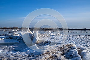 Spring evening in Arkhangelsk. Ice drift on the Severnaya Dvina river. The world`s northernmost drawbridge