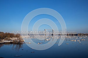 Spring evening in Arkhangelsk. Ice drift on the Severnaya Dvina river. The world`s northernmost drawbridge
