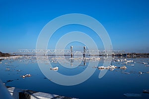 Spring evening in Arkhangelsk. Ice drift on the Severnaya Dvina river. The world`s northernmost drawbridge