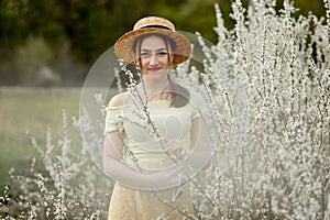 Spring fashion girl outdoor portrait in bloom . Beauty Romantic woman in flowers. Beautiful Woman Enjoying Nature