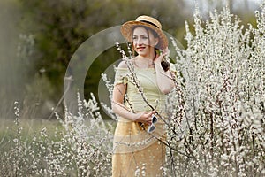 Spring fashion girl outdoor portrait in bloom . Beauty Romantic woman in flowers. Beautiful Woman Enjoying Nature