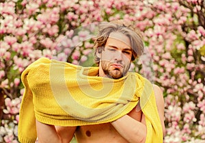 Spring fashion style. Male sexuality. sakura background. enjoy good weather. fresh blossom flower. unshaven man magnolia