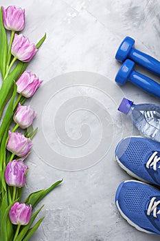 Spring flatlay composition with sport equipment and tulips