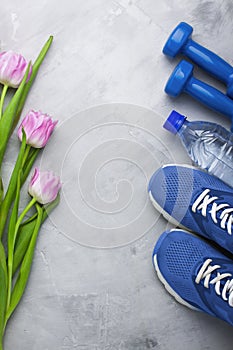 Spring flatlay composition with sport equipment and tulips