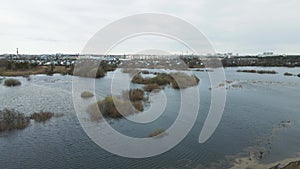 Spring flood, bird's-eye view of the river flood, flooded fields.