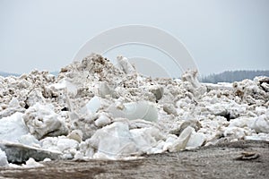 Spring flood threat. The ice jam on the river.