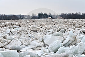 Spring flood threat. The ice jam on the river.