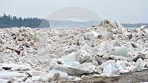 Spring flood threat. The ice jam on the river.