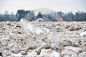 Spring flood threat. The ice jam on the river.