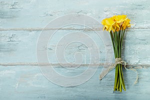 Spring floral border, beautiful fresh daffodils flowers, isolated on white background. Selective focus