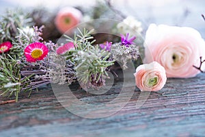 Spring floristry on weathered wood photo